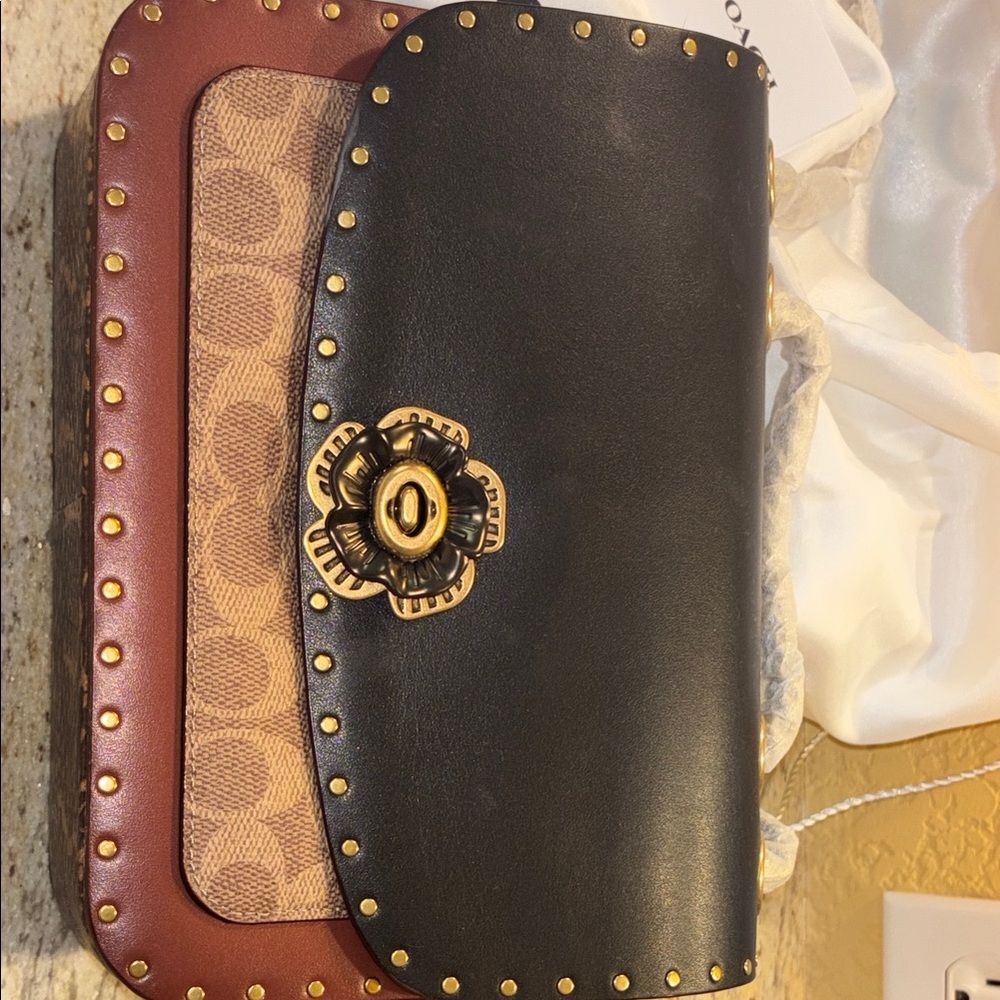 Coach Parker shoulder bag.Black & Brown leather, camelia clasp.With dust bag.New